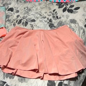 Peach Skort bikini bottoms with peach and Torquise and white large top.